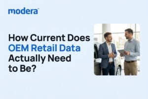 Two men talking beside a car in a dealership showroom, with the title "How Current Does OEM Retail Data Actually Need to Be?"