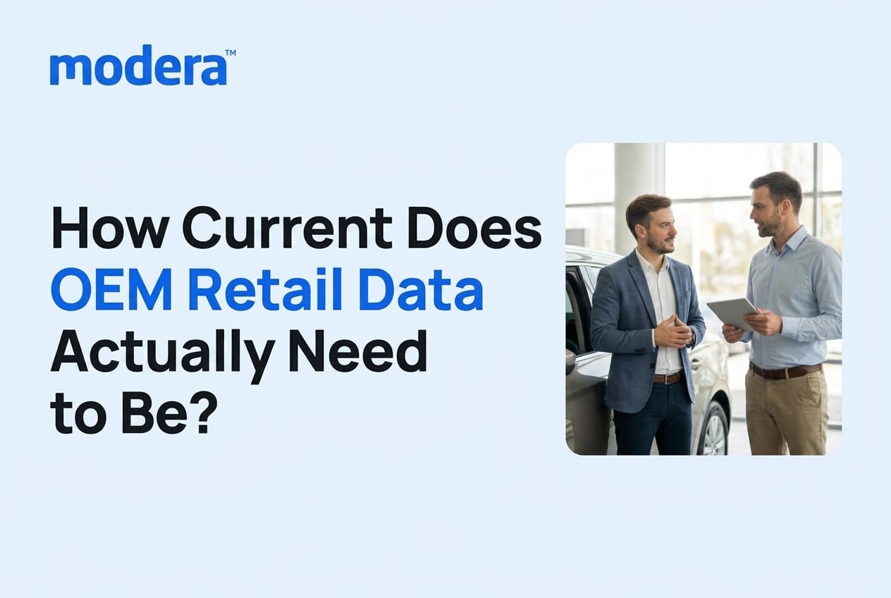 Two men talking beside a car in a dealership showroom, with the title "How Current Does OEM Retail Data Actually Need to Be?"